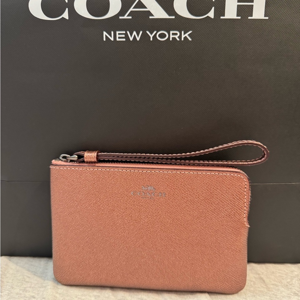Coach pink metallic gently used minimal signs of ware refer to pictures.